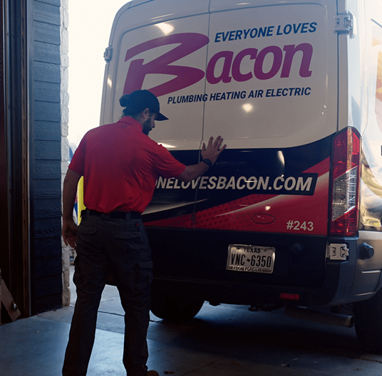 Bacon employee closing van door